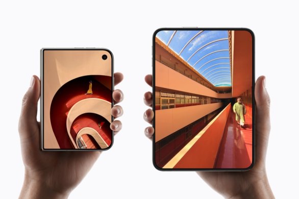 Two hands holding iPhone Duo, one folded and one unfolded